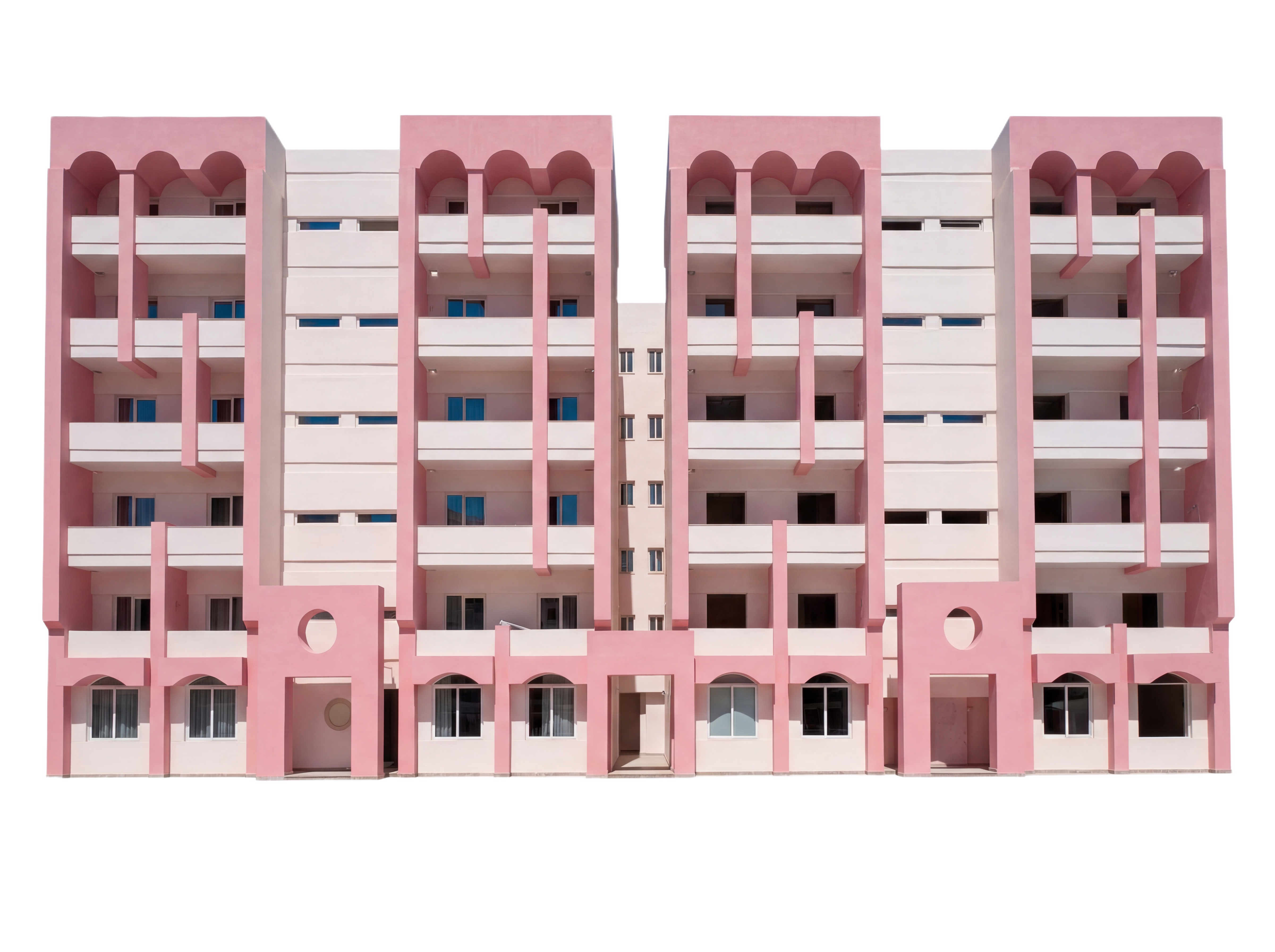 The Flamingo Apartments — pink postmodern building with arches and scalloped roofline